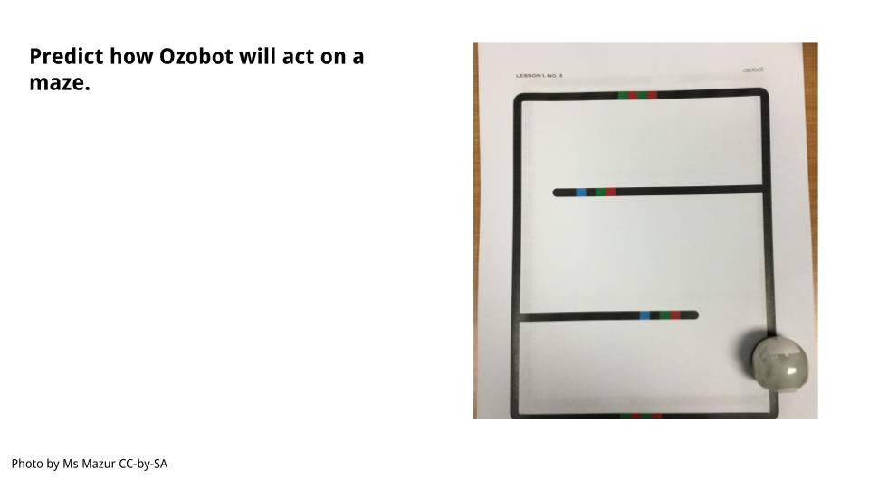Ozobot sits on the maze.